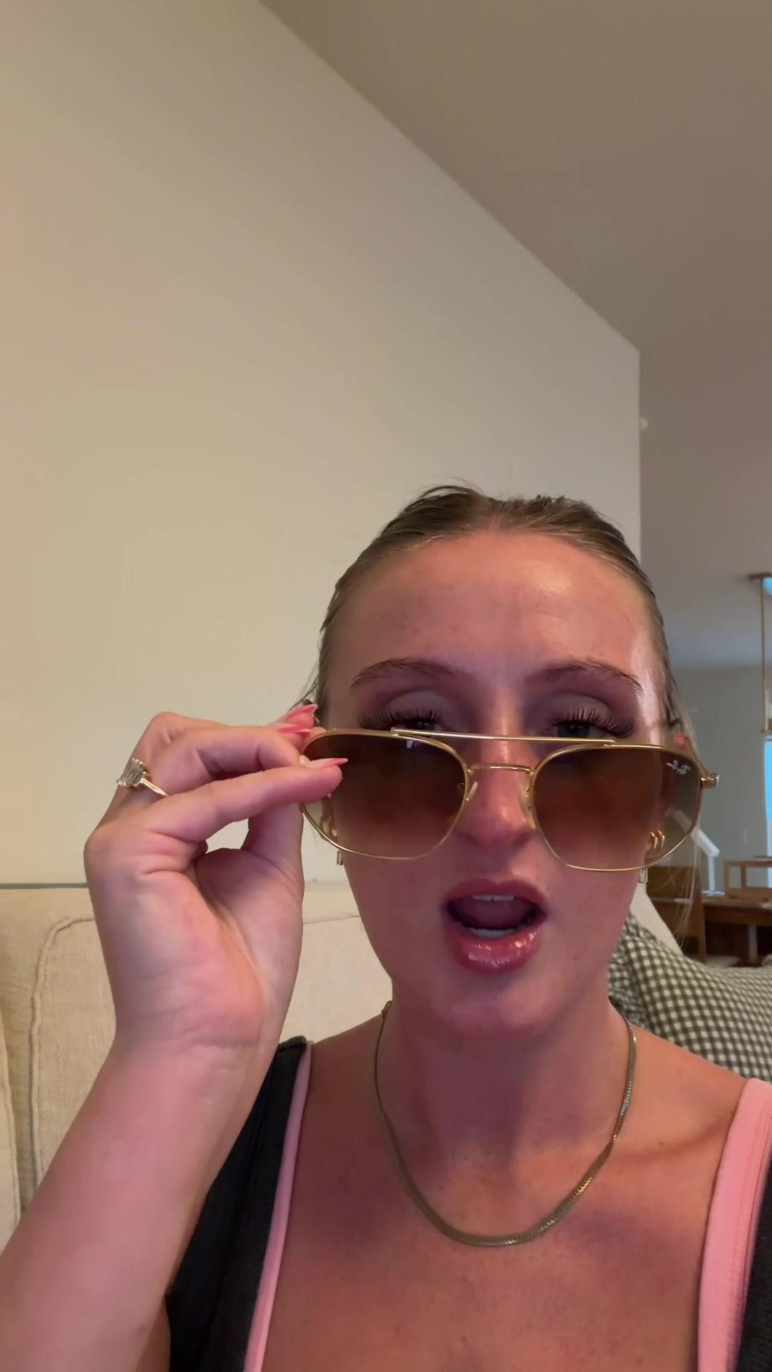Woman Removing Sunglasses in Shock