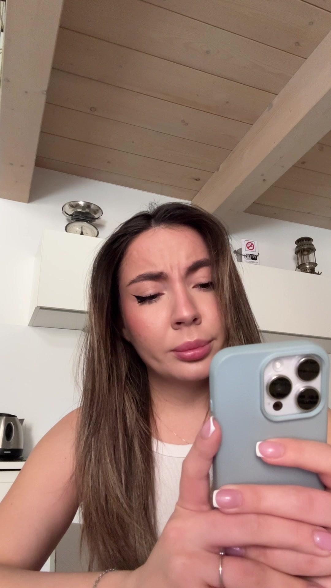 Woman Sneezes with Confused Expression