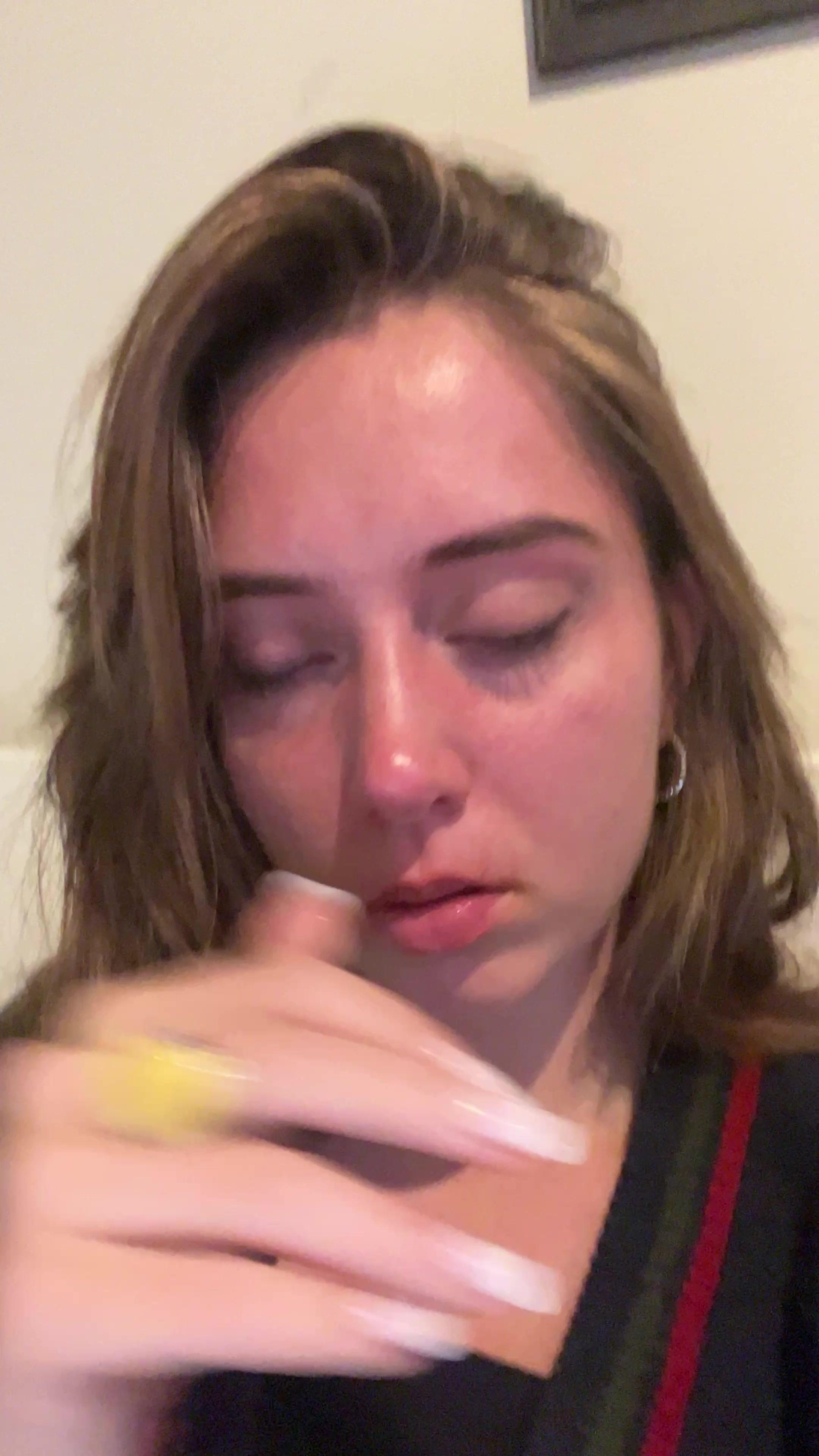 Young Woman Crying and Touching Her Face