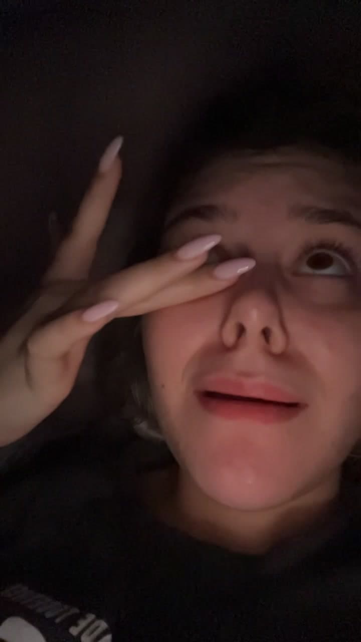 Tired Young Woman Rubbing Her Eyes