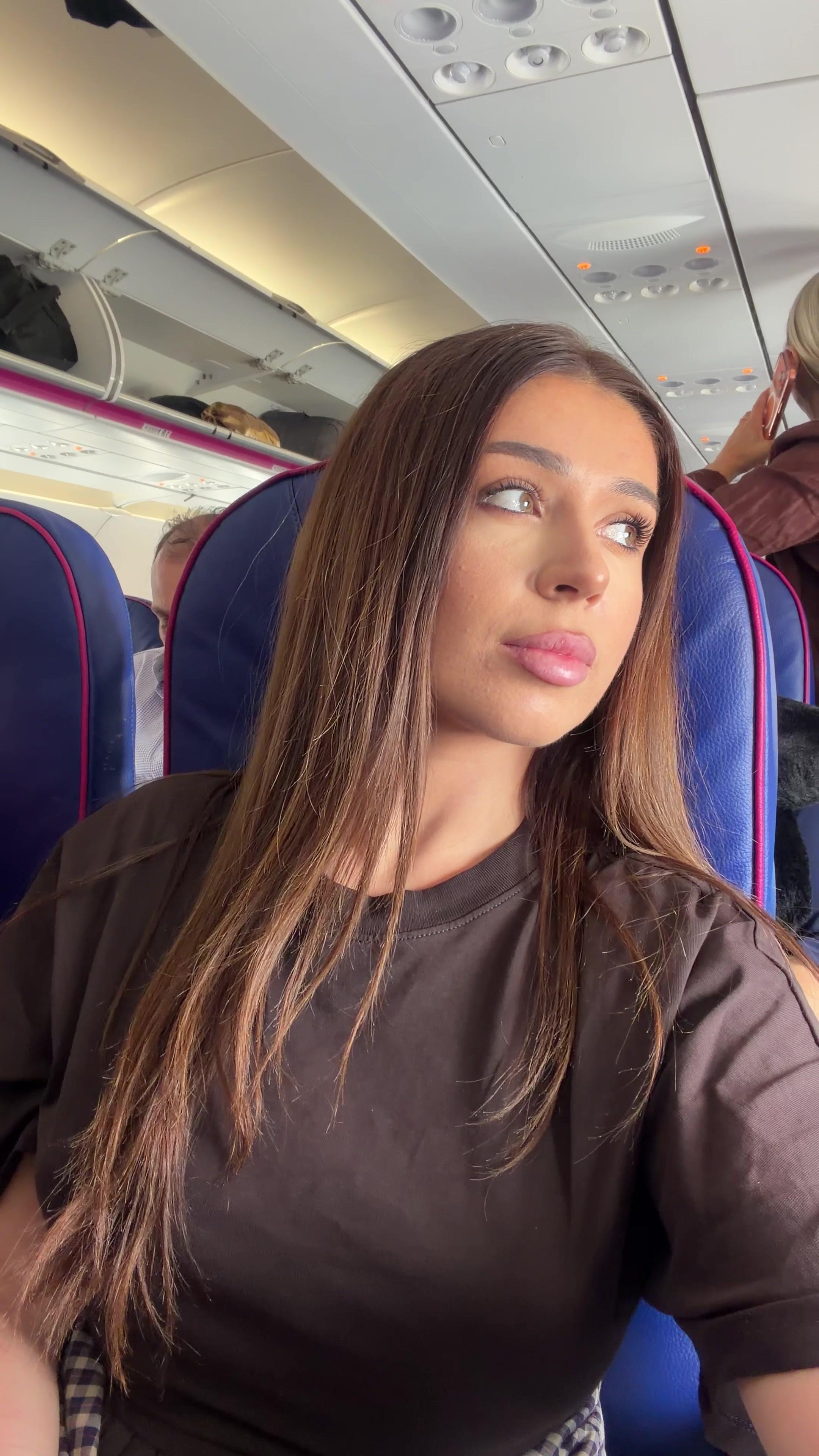 Woman Looking Thoughtful on Airplane Seat