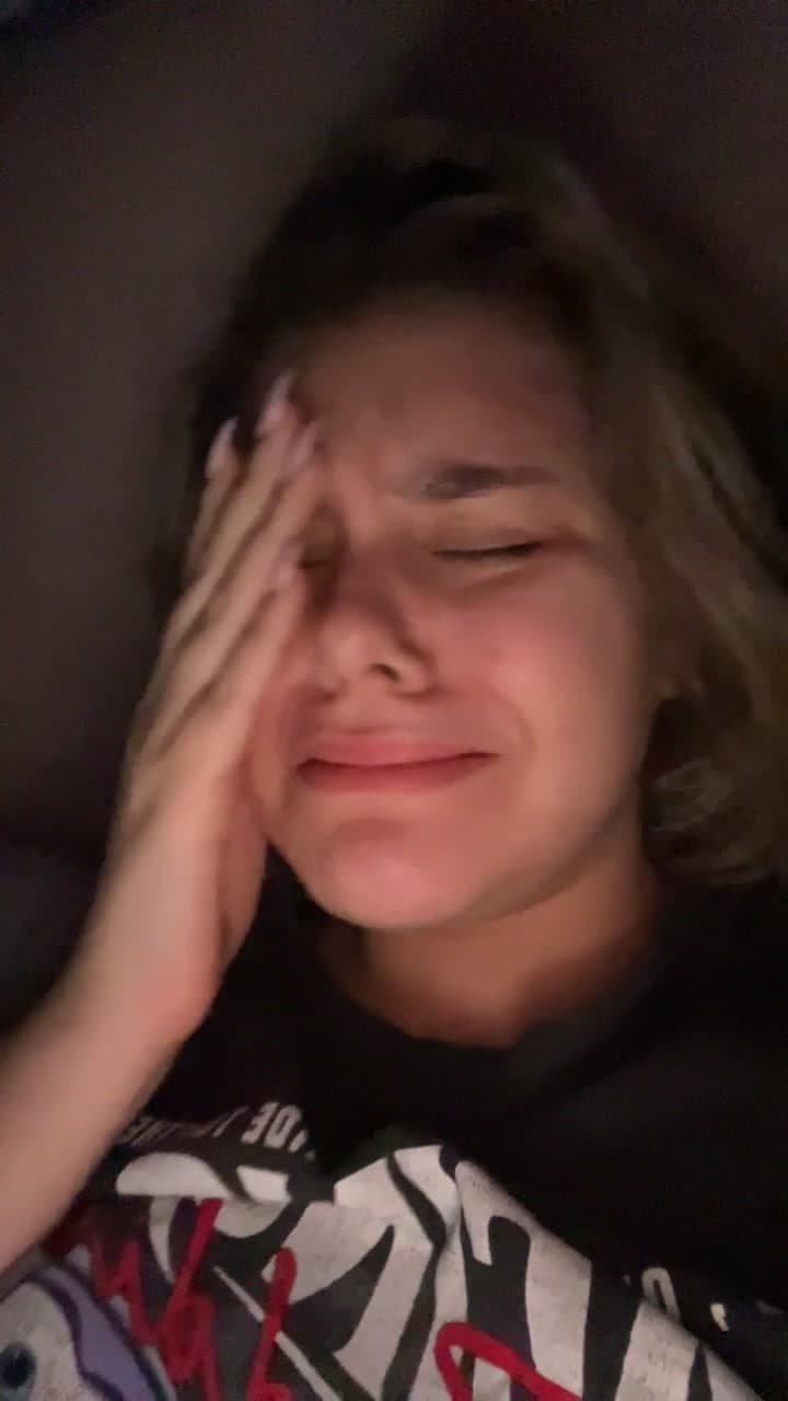 Young Woman Crying in Bed