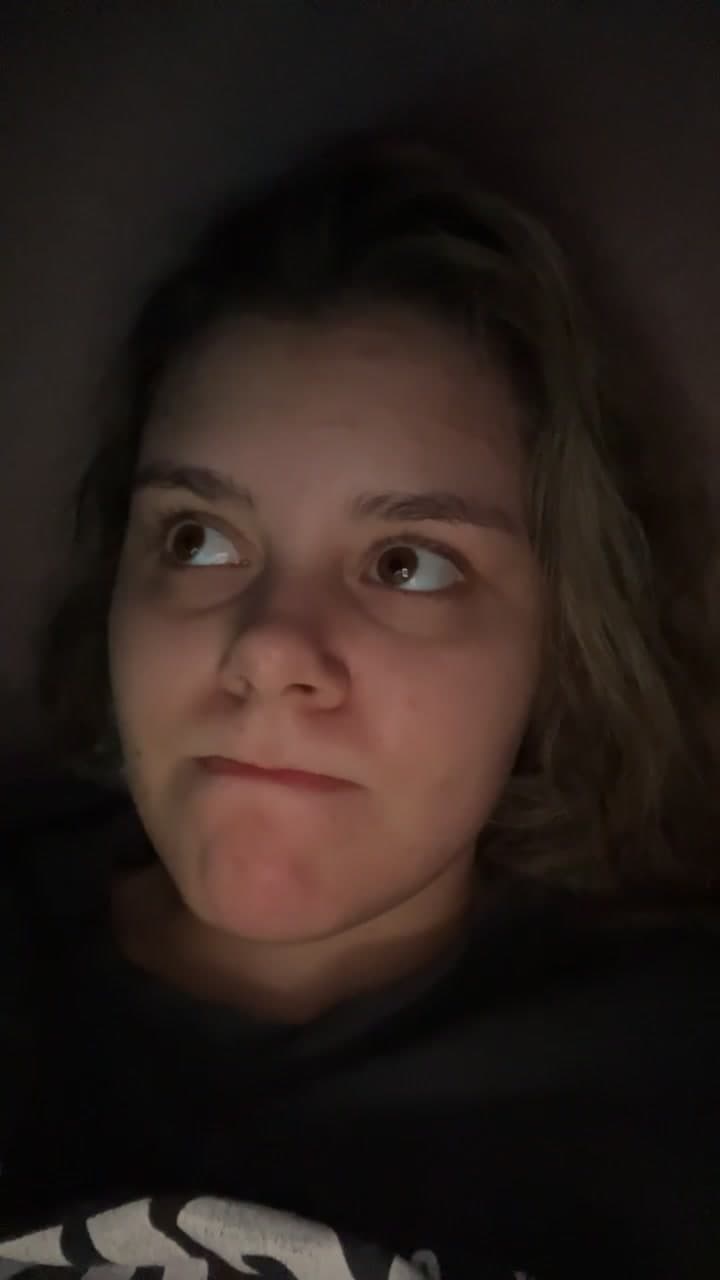 Woman Lying Down Looking Thoughtful